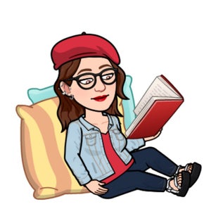 Teacher reading a book on the floor