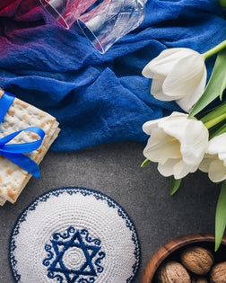 top view of kippah, matza and wine, jewish Passover holiday concept