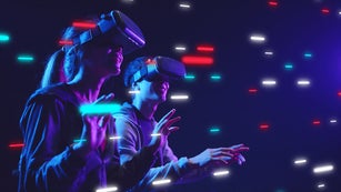 Metaverse VR virtual reality game playing, man and woman play metaverse virtual digital technology game control with VR goggle