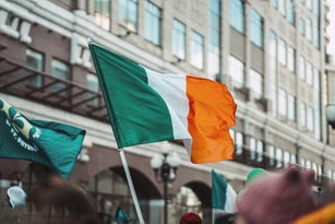 Low Angle View Of Flag Against Buildings In City