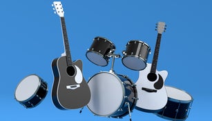 Set of electric acoustic guitars and drums with metal cymbals on blue background