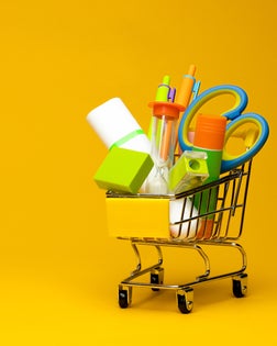 School supplies in decorative shopping cart