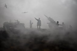 An anti-aircraft cannon and Military silhouettes fighting scene on war fog sky background. Allied air forces attacking on German positions. Artwork decorated scene.