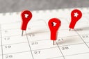 The concept of planning and deadline with push pin on calendar date.