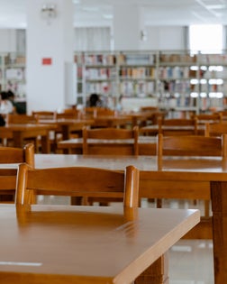Empty wooden tables in the public library