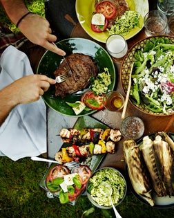 Overhead view of friends dining at table outdoors