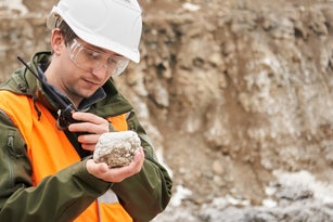geologist examines a mineral sample