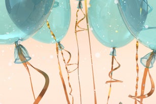 Festive background with close up view of blue balloons floating against a pastel peach background