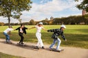 Friends skateboarding in a park