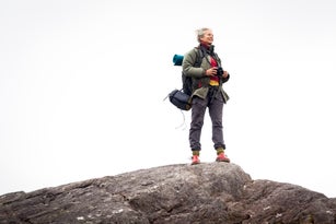 Older woman trekking in the mountains of ireland