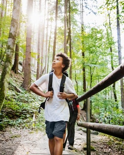 Young Boy Enjoying The View While Hiking
