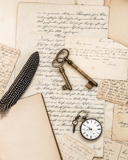 Old handwritten letters, pictures and antique writing accessories
