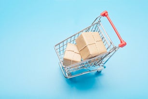 Still life of a small shopping cart and parcels