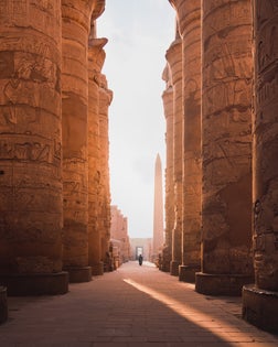 ancient corridor and columns of Karnak temple complex in Luxor city Egpyt during sunrise