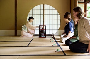 Woman preparing traditional tea for guests