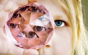 Girl looking through a prism glass