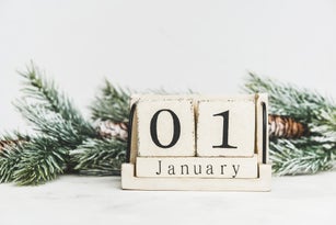 Christmas card with calendar block and pine branch