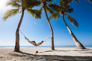 Woman relaxing in a hammock, Panglao, Bohol, Philippines