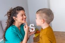Shot of a speech therapist during a session with a little boy