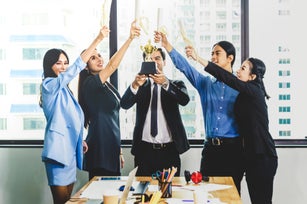 Business Team Achievement Success Mission Concept.People with hand holding trophy and award cerfiticate.