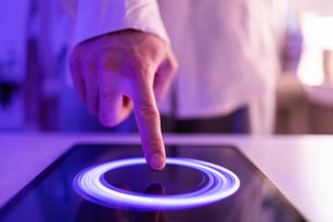 Close-up of touching digital tablet