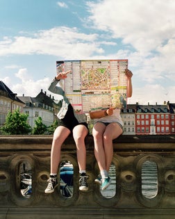 Teenager hidden by city map