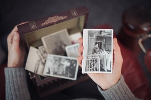 Senior woman discovering old photographs