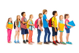 School kids with backpacks and textbooks