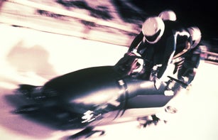 FOUR-MAN BOBSLED TEAM SPRINTING TO BUILD MOMENTUM / START OF RUN