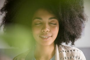 Portrait of African American woman with eyes closed