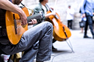 Close-Up Of Man Playing Guitar