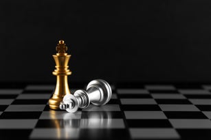 Gold and Silver Colored Chess King Pieces Checkmate