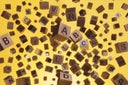 Abstract Background of Wooden Text Alphabet Block Floating in the Air on Yellow Background