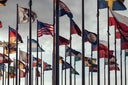 Flags of different nations on high flagpoles
