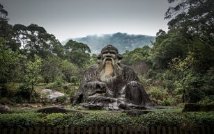 Weathered sculpture of male elder, Fujian, China