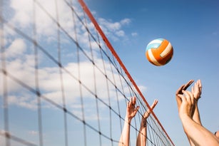 Cropped image of people Volleyball at beach