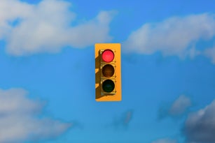 Stoplight floating in sky