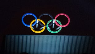 Olympic symbol (also known as Olympic Rings) seen on the Montreal olympic Committee building lit during a dark night. Montreal became an olympic city with the 1976 Summer Olympic Games