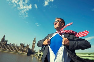 Smiling Superhero Member of Parliament Businessman Stands At London Skyline